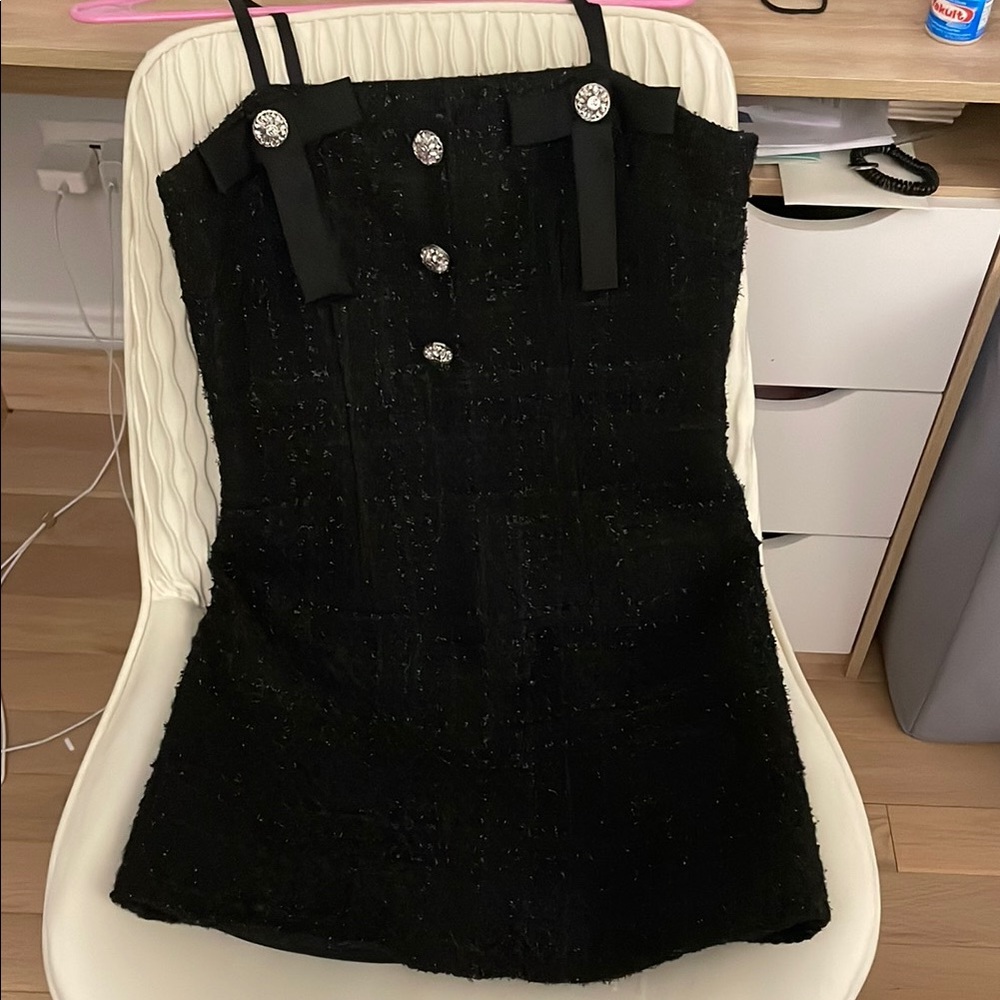 Elegant Black Dress with Button Accents